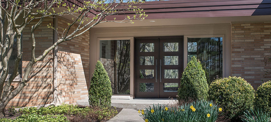 Large inviting double wooden front doors