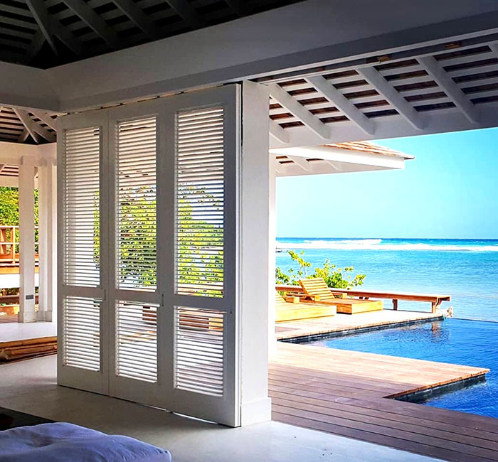 Louvered Exterior  Poplar Shutters with an Ocean View